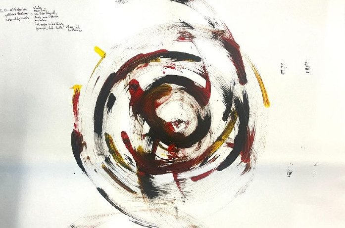 Dense black and red painted spiral