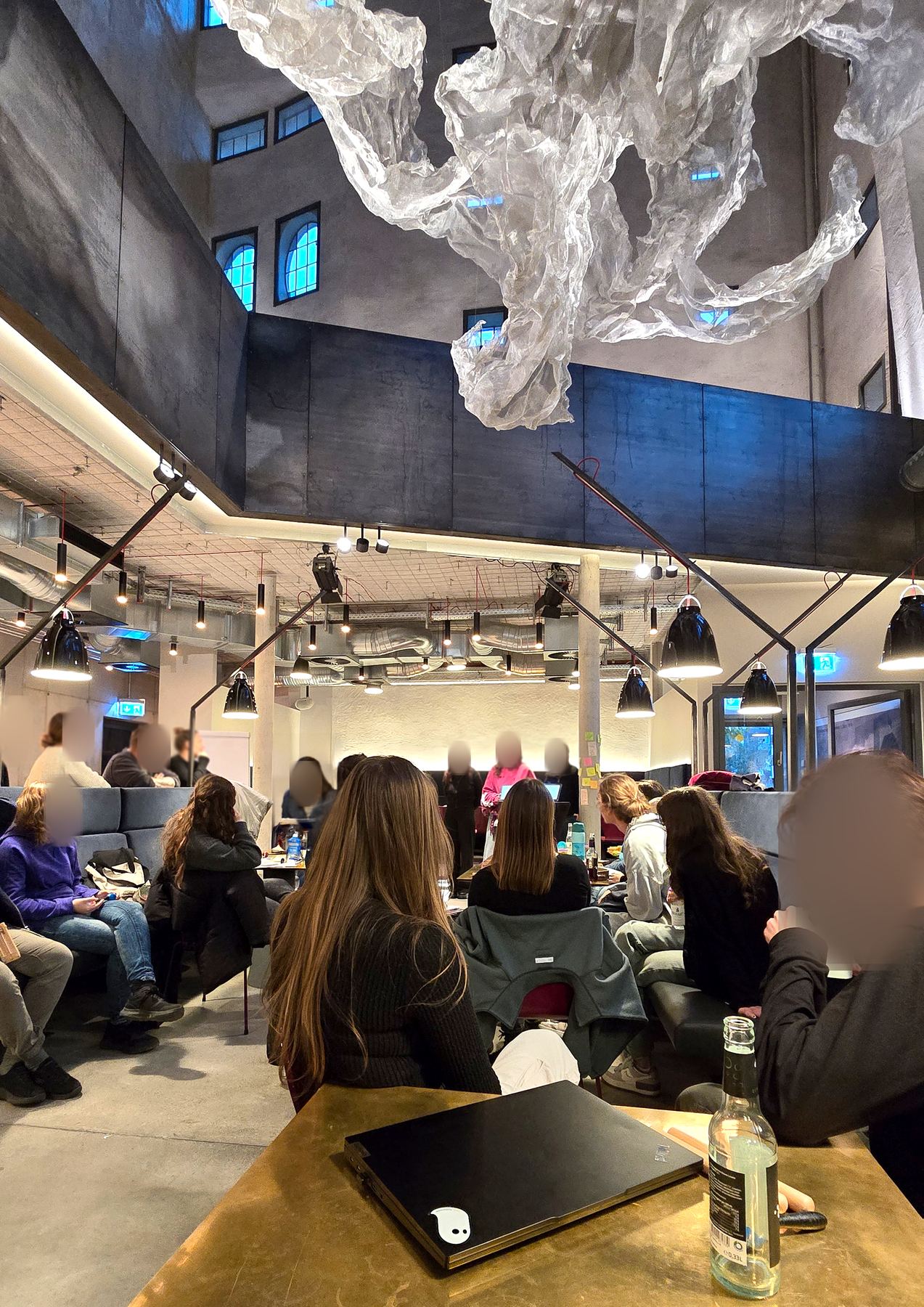 Workshop room in the Ofenhaus with a large translucent sculpture hanging from the ceiling